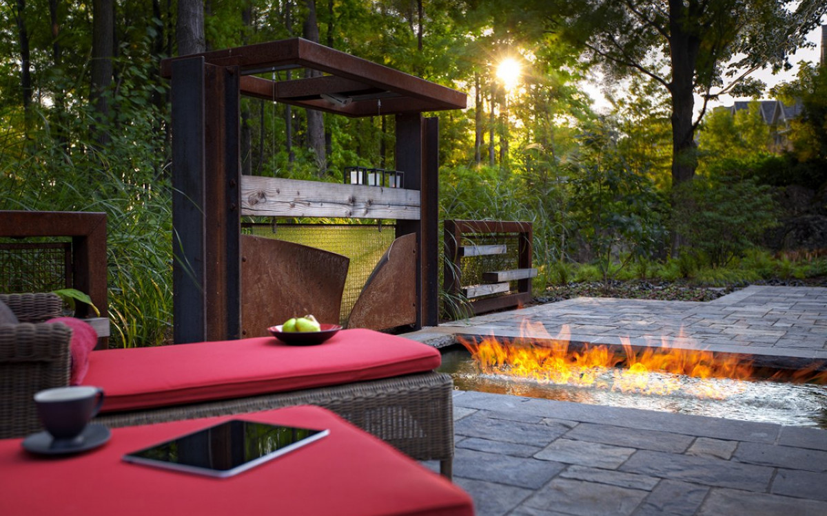 Modern firepit in a backyard.
