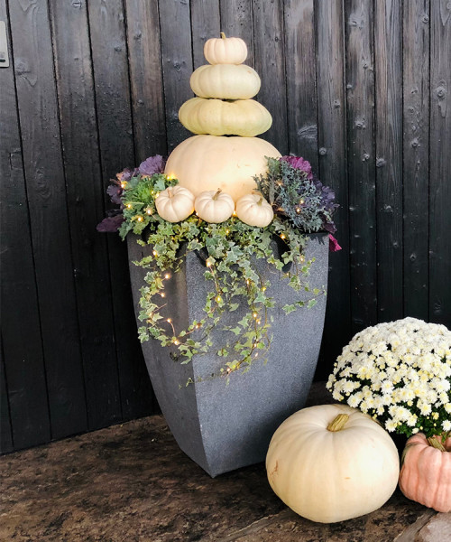 planter with lights and pumpkins