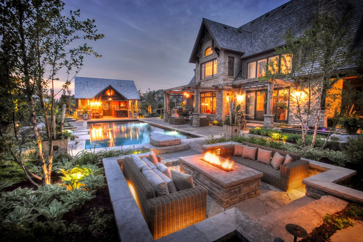 Backyard with firepit and pool.
